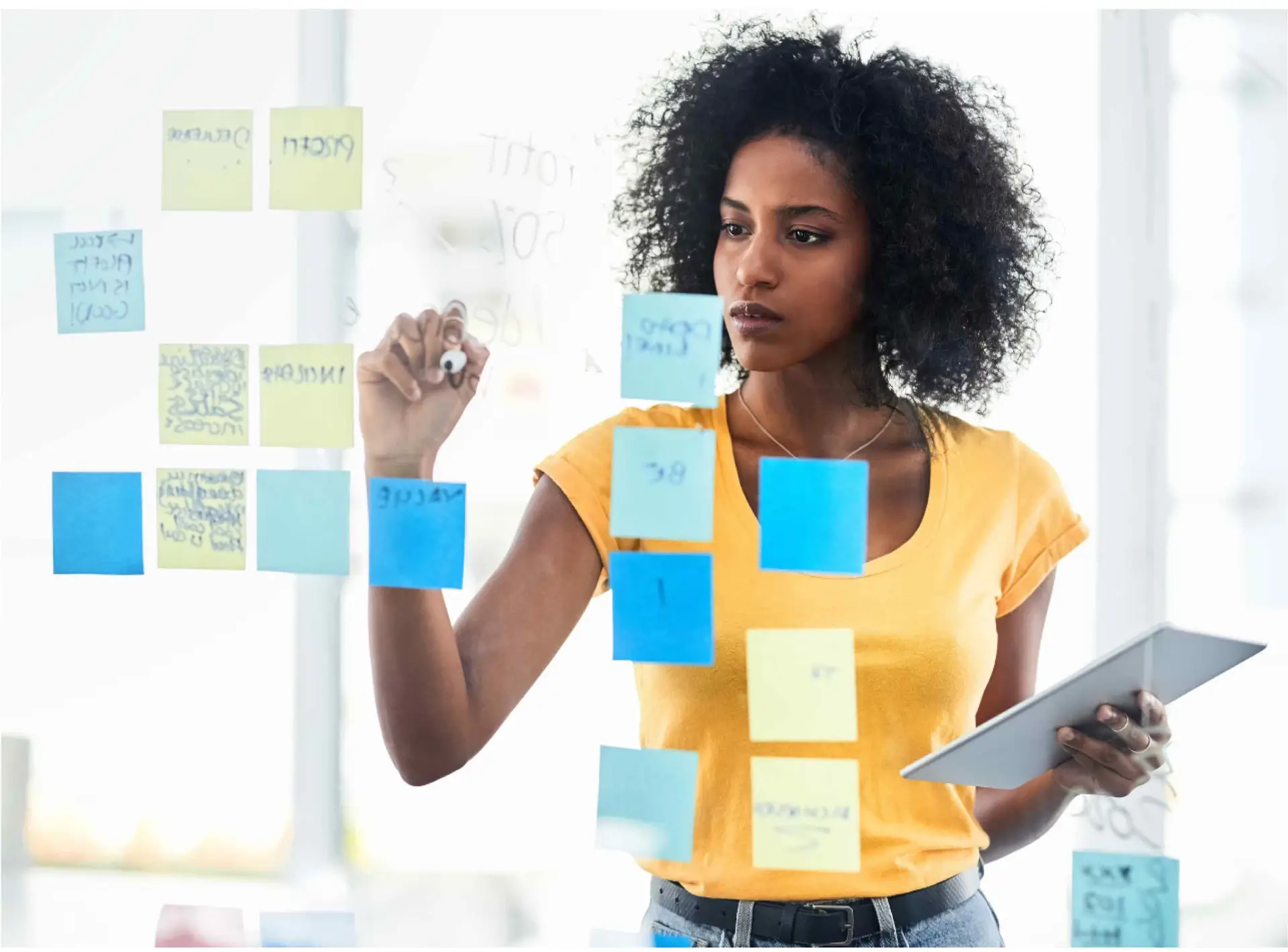 Woman with post-it notes to set realistic goals for social anxiety